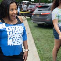 Volunteer smiling off camera
